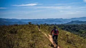 man cycling near hills