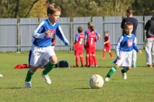 children playing football